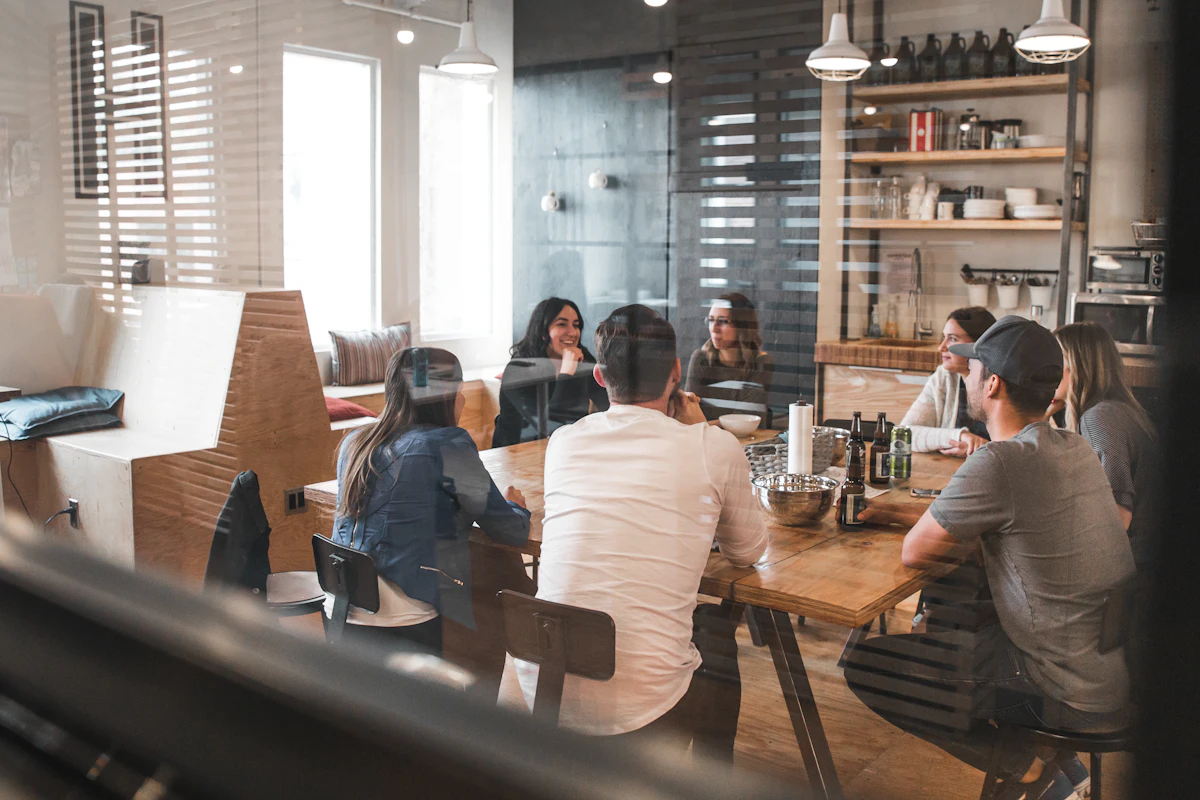 A managed team working together on an outcome around a table